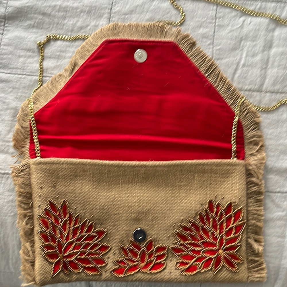 Raffia clutch with red lotus design